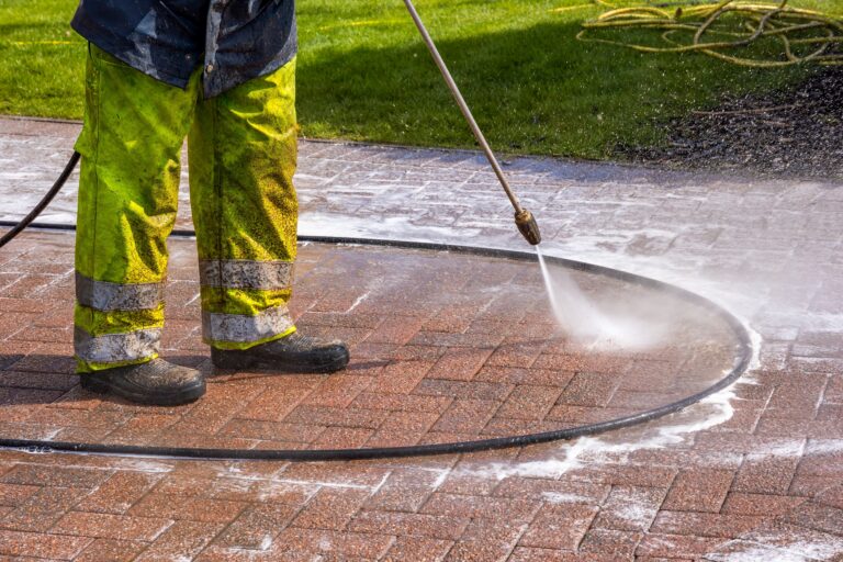 Worker,In,Yellow,Protective,Clothing,Pressure,Washing,Monoblock,Brick,Paver